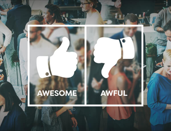 There is a crowd of people slight out of focus and over the top is a white rectangle with a thumbs up icon with the word awesome under it and a thumbs down icon with the word awful under it.