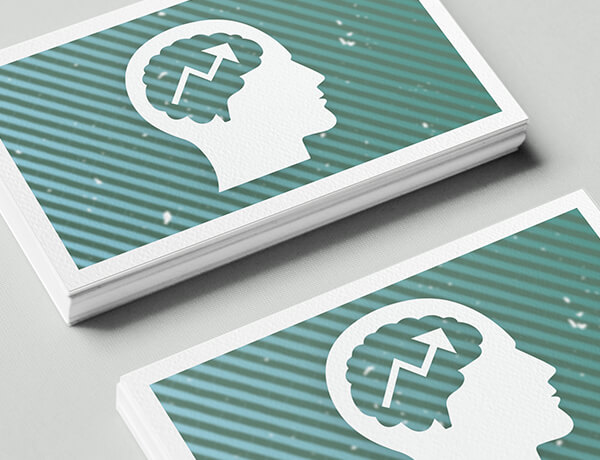 white and green cards hat have the silhouette of a head with the brain showing and chart arrow going up in the brain
